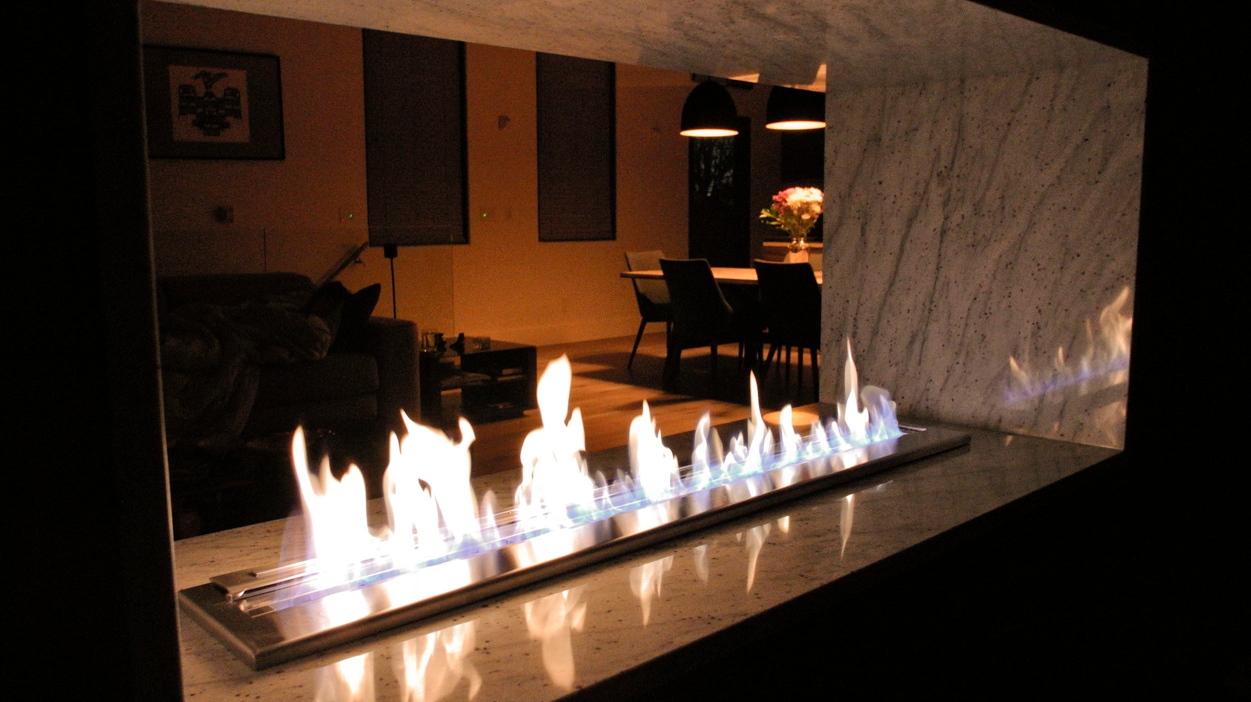 A beautiful ethanol fireplace at nighttime.