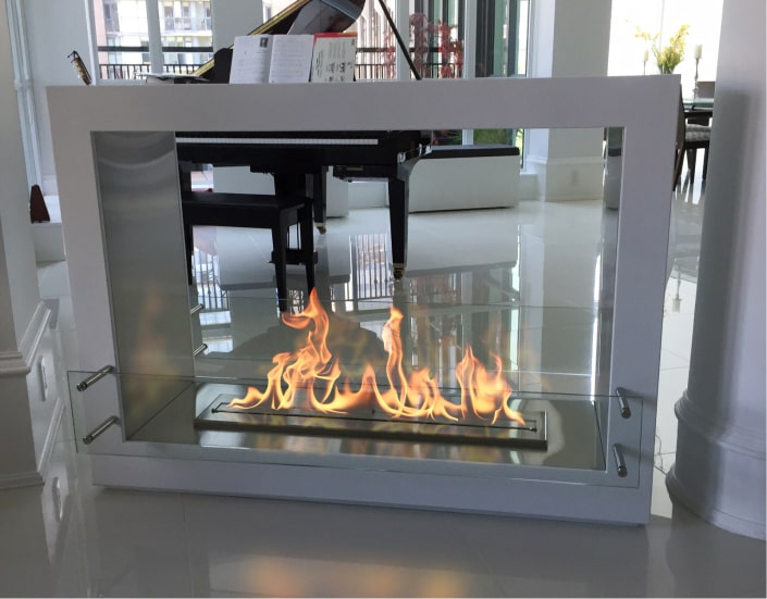 A double-sided ventless fireplace using ethanol fireplace fuel.