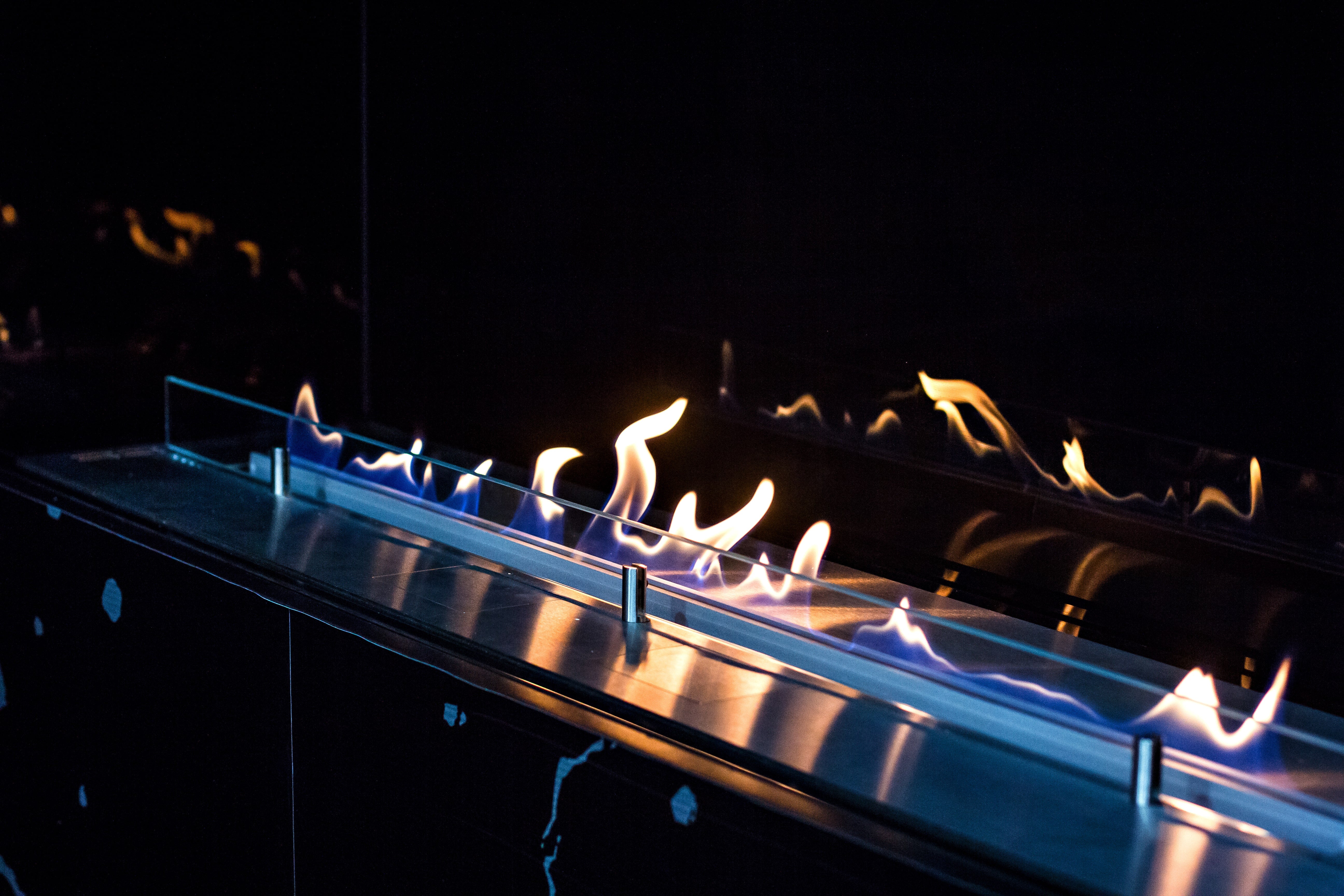 Ethanol burner’s orange dancing flames.
