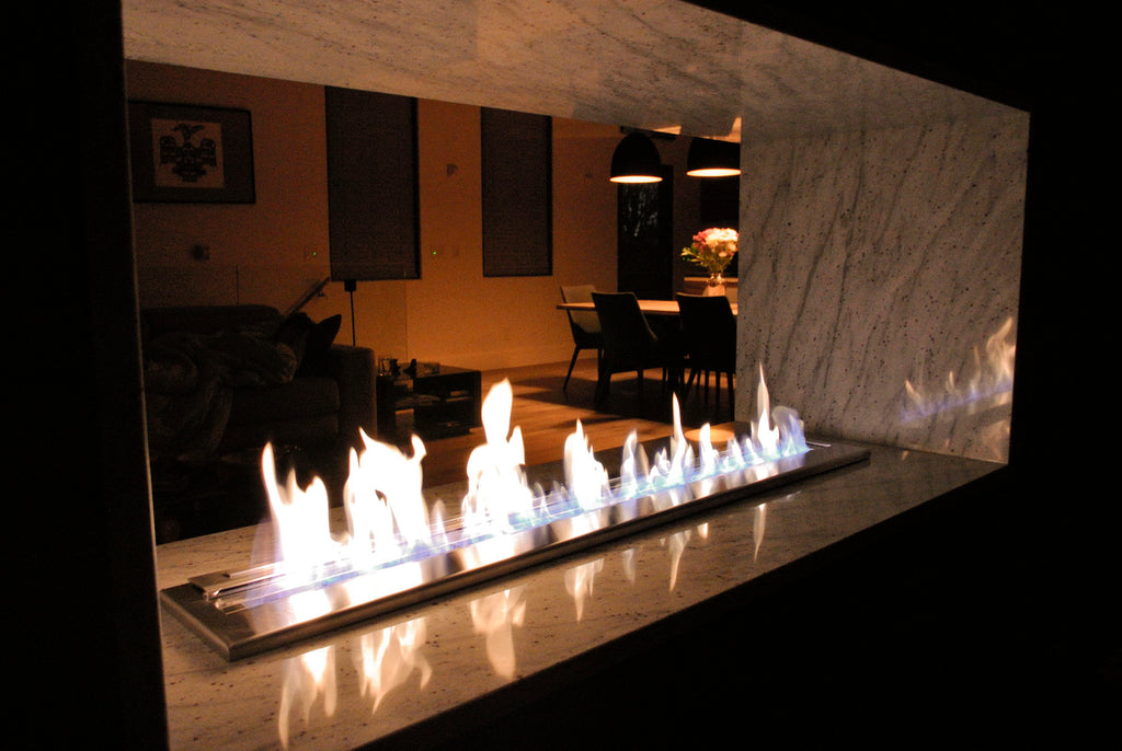 A beautiful ethanol fireplace at nighttime.